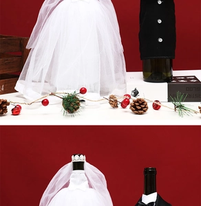 Detailed view of creative wedding gown and suit wine bottle covers for festive party decor