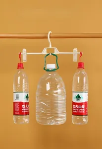 Strong white plastic pants hanger showing heavy load capacity with water bottles