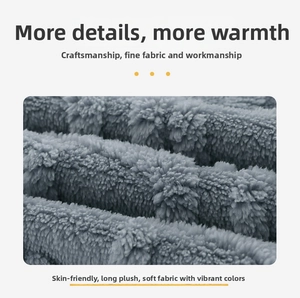 Close-up of thick grey lamb wool blanket showing soft plush texture and skin-friendly fabric