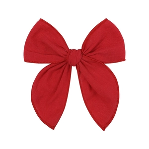 Classic red fabric hair bow clip for girls featuring a handmade knot and symmetrical wings