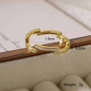 Detailed view of irregular gold ring with shell inlay and cubic zirconia stones