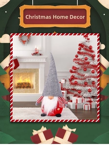 Christmas gnome plush doll with a long pointed hat and white beard in a cozy indoor setting