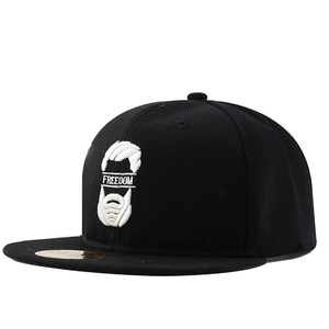 Detail of high-density freedom white embroidery on black snapback baseball cap