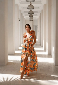 Detail view of floral maxi dress with deep V-neck and cut-out waist in exotic gallery