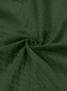 Close-up of dark green men's long sleeve shirt showing jacquard waffle texture fabric