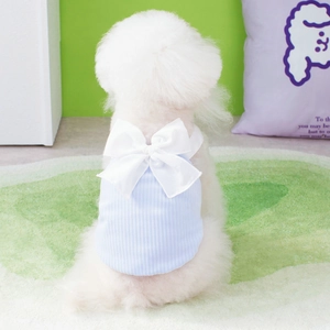Light blue striped dog vest with large white bow detail on dog back view