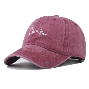 Detail of dachshund silhouette and love text embroidery on vintage washed burgundy cap