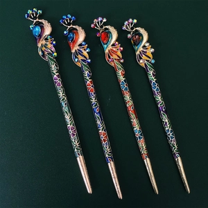 Detail of four peacock hairpins with colorful enamel and crystals on green backdrop
