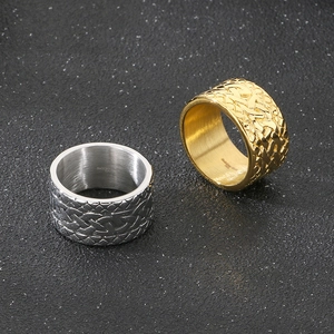 Macro view of woven Celtic texture and 316L stainless steel engraving on vintage rings