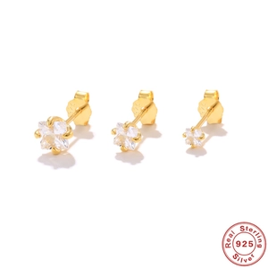 Detailed macro view of S925 sterling silver gold plating and clear star zircon earrings