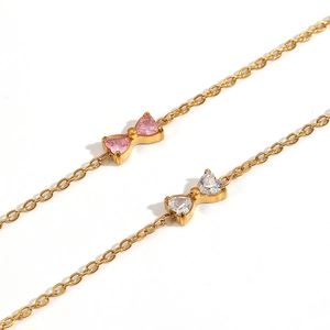 Elegantes vergoldetes Edelstahlarmband mit rosa und weißen Zirkon-Schleifenanhängern