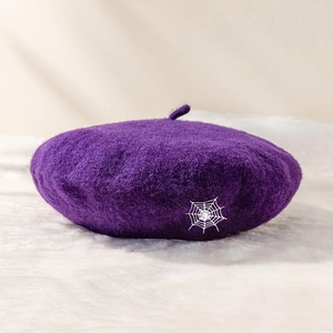 Dark purple wool beret with white spider web embroidery for a gothic style look