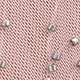 Detailed macro view of pink twill fabric featuring silver square metal rivet decorations
