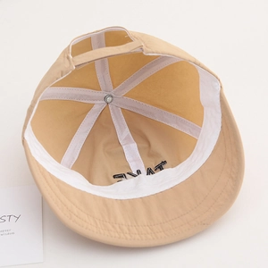 Inside view of khaki sun hat with reinforced white stitching and sweatband details