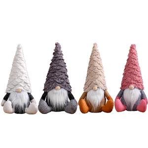Set of four Nordic Christmas Gnomes in pastel colors with textured hats on white background