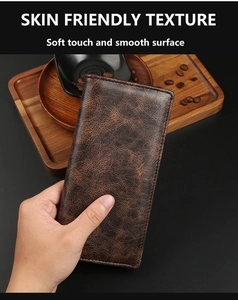 Macro shot of retro dark brown leather wallet showcasing soft marble texture and finish
