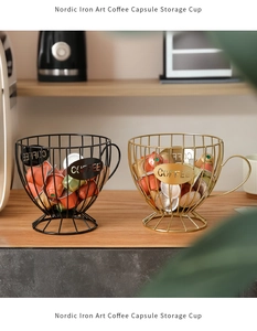 Detail of metal wire coffee capsule baskets in black and gold with 'COFFEE' lettering