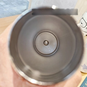 Detailed macro view of food-grade SUS 316 stainless steel interior liner with engraved stamp