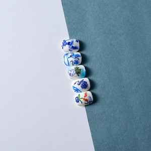 Detail of 5D blue and white porcelain nail stickers with crane and floral patterns