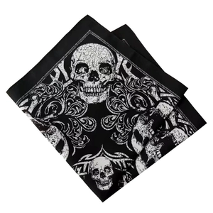 Cotton bandana featuring white skull and tribal totem pattern on black fabric