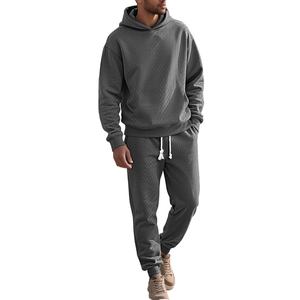 Men's dark gray tracksuit set with oversized hoodie and joggers featuring diamond textures