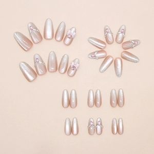 30 uñas postizas ojo de gato rosa con lazos 3D y diamantes sobre fondo rosa