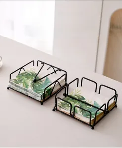 Modern black iron napkin holders with gravity bar and minimalist cutout frame designs