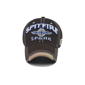 Close-up of high-density SPARK embroidery on a vintage washed cotton baseball cap