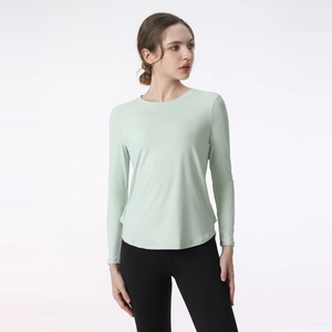 Women's mint green long sleeve yoga top with breathable quick-dry fabric and crew neck