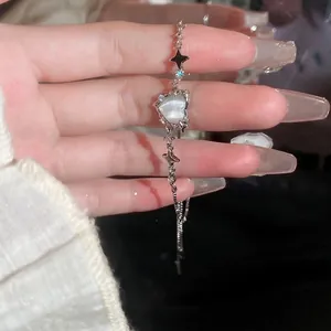 Bracciale a catena argento con occhio di gatto a cuore, ciondoli a stella e zirconi