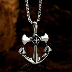 Men's silver stainless steel anchor pendant necklace with cross detail on wooden background