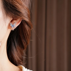 Silver butterfly ear clip with blue wings and zircon studs for non-pierced ears