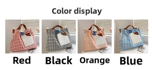 Detail showing checkered canvas tote bags in red black orange and blue with leather straps