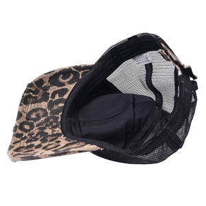 Baseball cap with leopard print brim and black mesh back shown in an interior view