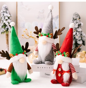 Three Christmas gnomes with reindeer antlers and white beards in green, grey, and red felt