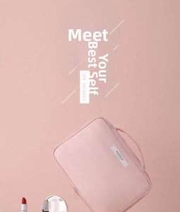 Pink waterproof nylon makeup bag with top handle and white Makeup Beauty logo label
