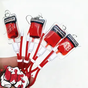 Detailed view of creative blood bag earrings with realistic red liquid for Y2K style