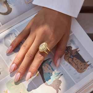 Close-up of golden 18K square locket ring with celestial star and moon zircon pattern