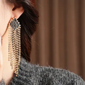 Vintage rhombus tassel earrings with black stones and silver needles on model