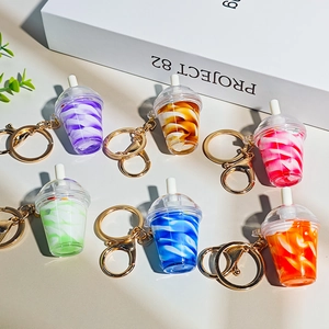 Detailed set of six colorful miniature sundae keychain charms with golden metal hooks