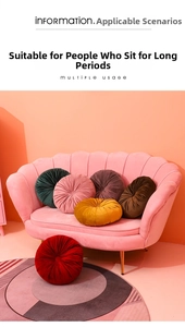 Detail of pleated velvet pumpkin cushions in various colors on a modern pink sofa