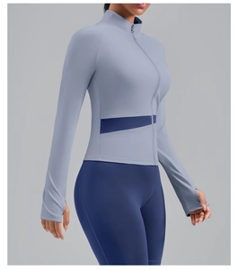 Detail of high collar zipper workout jacket with thumbholes and contrast waist paneling