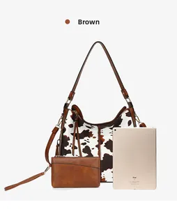 Brown tote bag and pouch set with cow print detail, shown with iPad for size reference