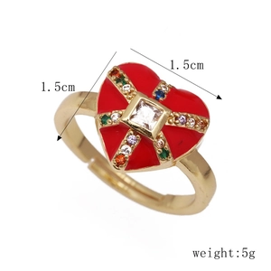 Detail view of gold heart ring with red enamel inlay and size and weight information