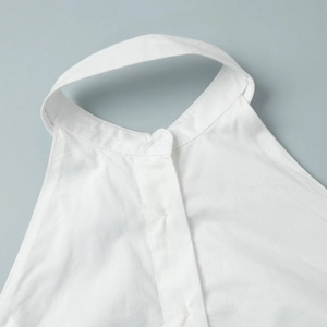 Detail of white cotton sleeveless shirt dress collar with sharp button placket texture