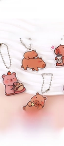 Detail of 4cm acrylic capybara keychain featuring double-sided printing and ball chain