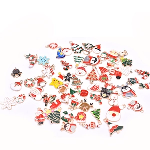 Mix of festive enamel Christmas charms featuring Santa, reindeer, and snowy trees
