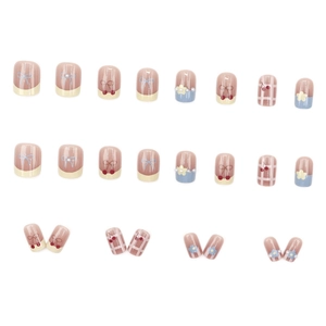 Sweet pink and blue press-on nails set with cherry, bow, and floral pearl accents