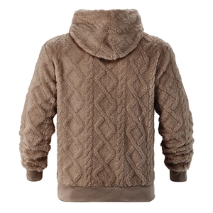Macro detail of brown hooded fleece sweatshirt showing the textured diamond weave pattern