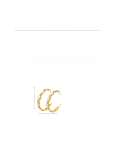 Detail of 18K gold plated C-shaped hoop earrings featuring imitation pearls and zircons
